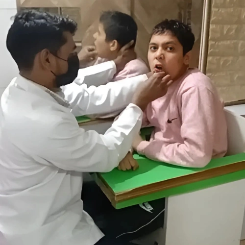 speech Special therapist providing rehabilitation therapy to a student with disabilities for improved mobility and sensory processing